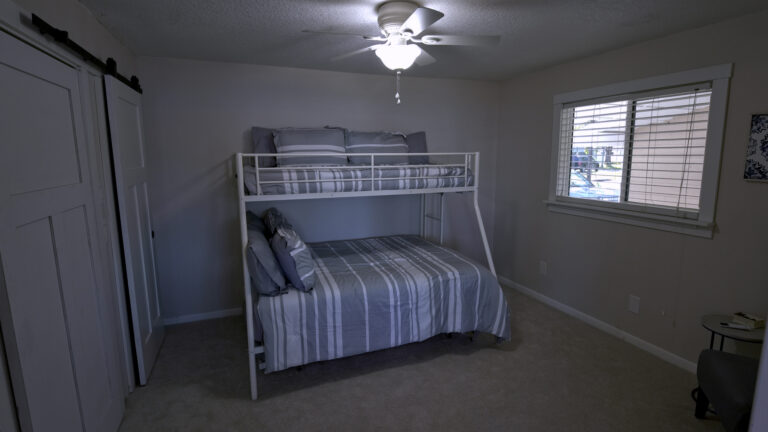 Twin over full bunk with an additional twin trundle