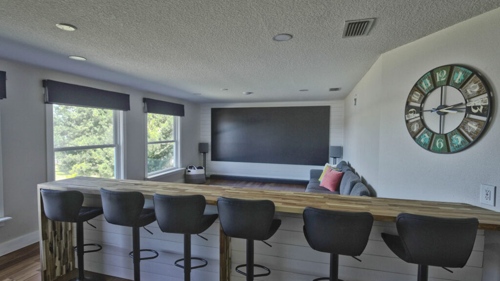 Indoor bar seating and living area in Lake Tarpon vacation home