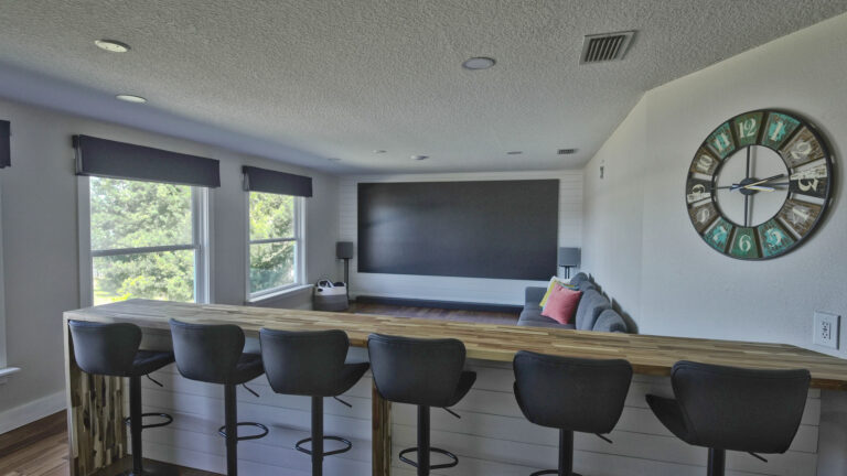 Indoor bar seating and living area in Lake Tarpon vacation home