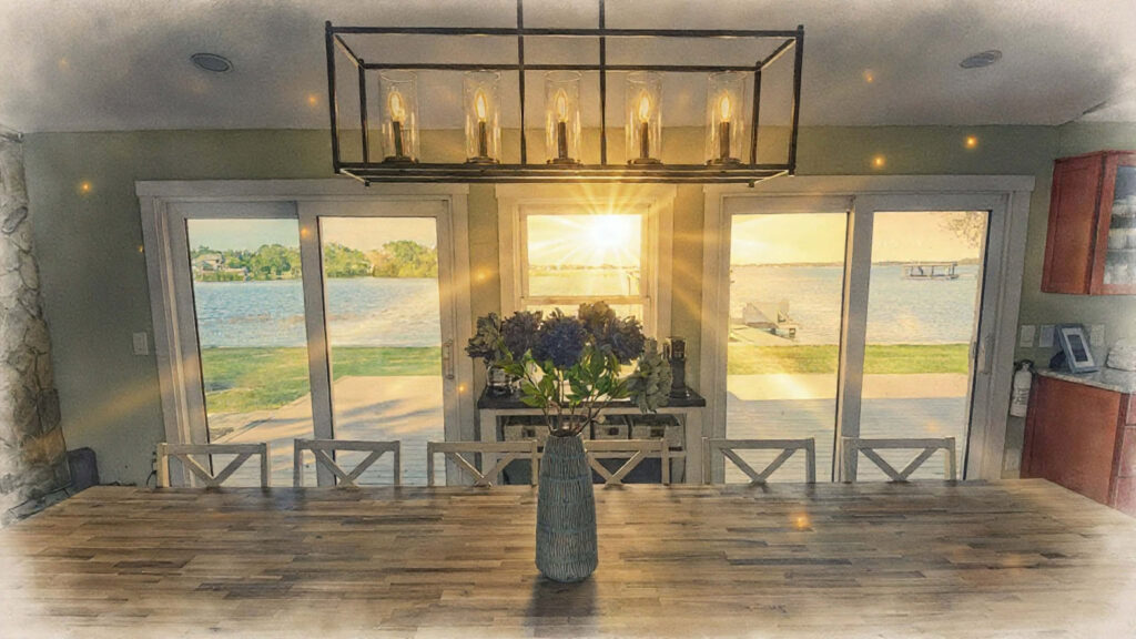 Lakefront dining table with sunset view at Lake Tarpon vacation rental
